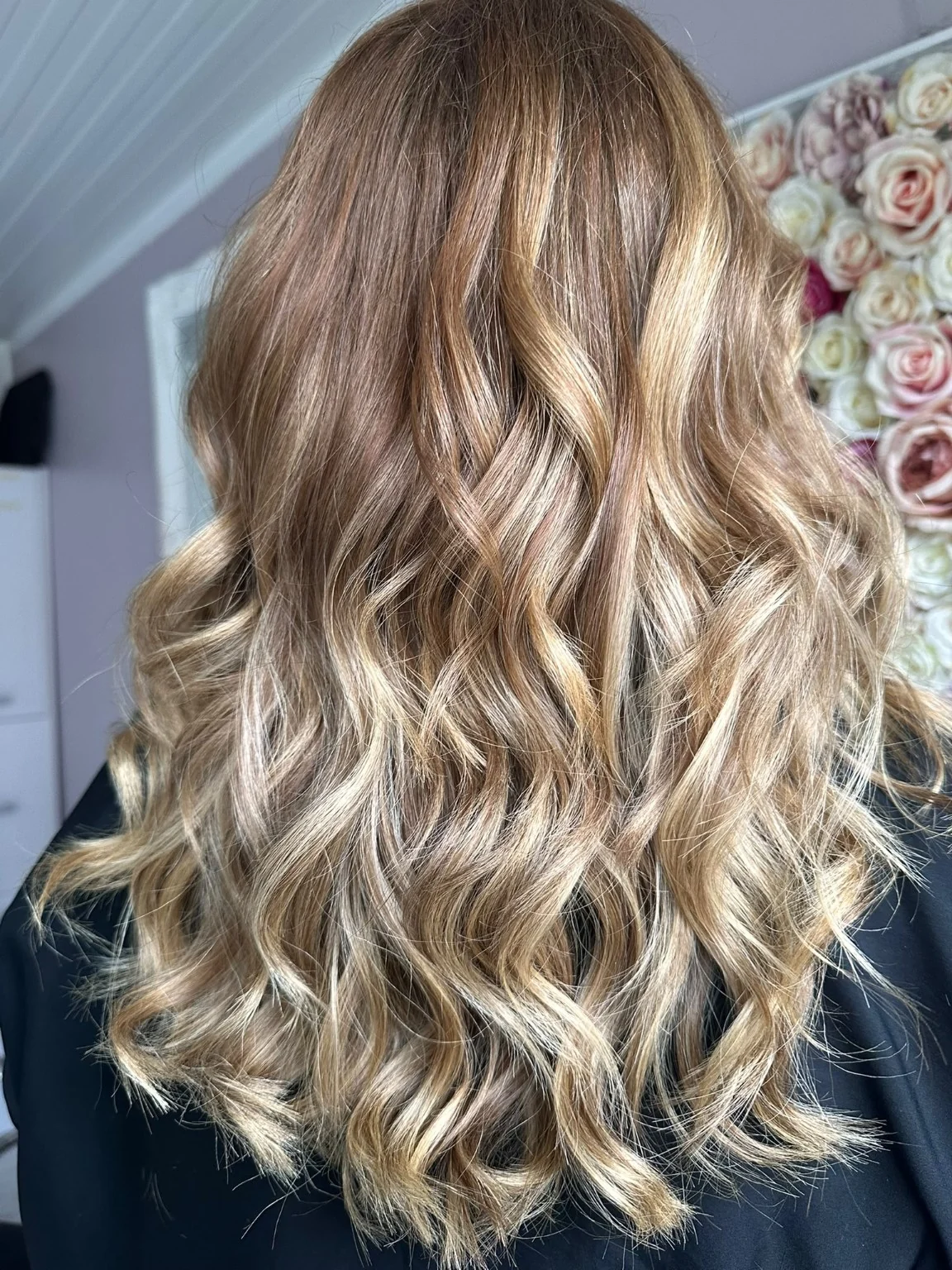 Long blonde and caramel highlighted hair with loose waves